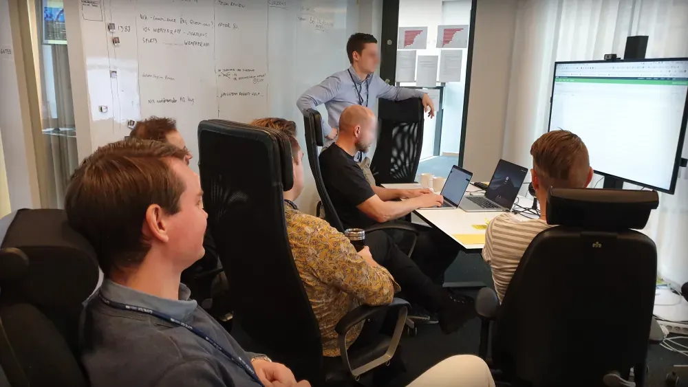 Mob Design in action – collaborative team around a large screen solving UI challenges together.